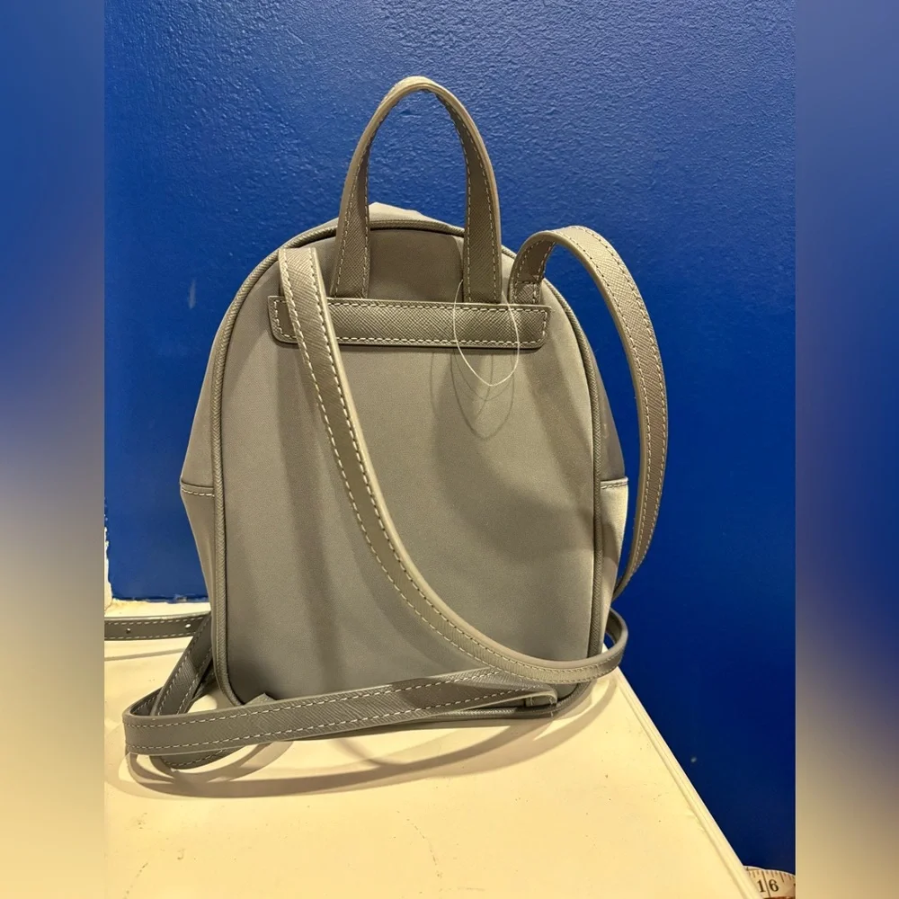 Kate Spade New York Mini Bradley nylon backpack in gray with gold zippers